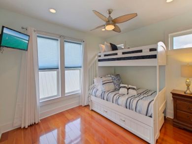 Bunk Room with Wall Mounted TV